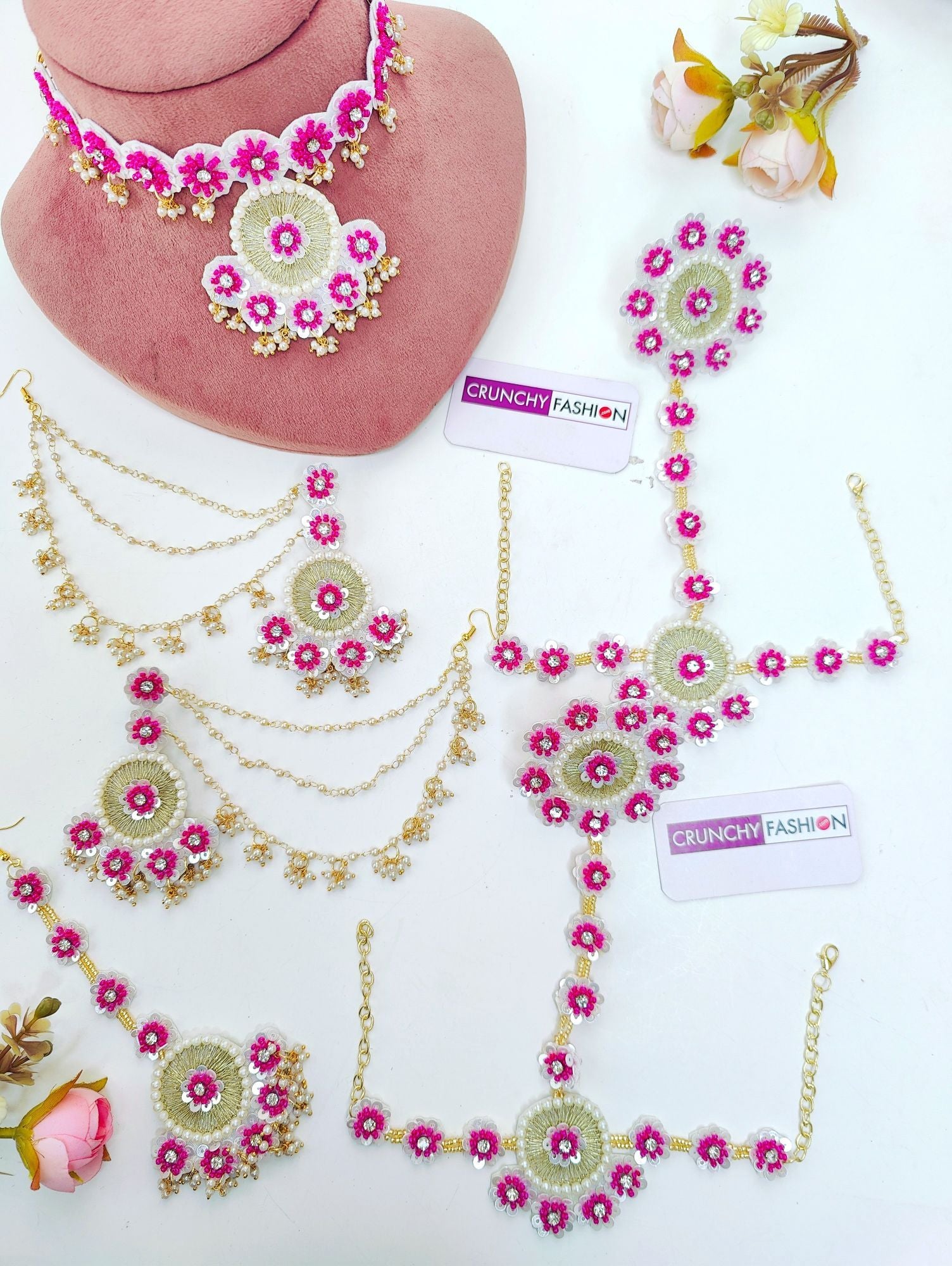 Handmade pink floral jewellery set with asymmetric design for brides, ideal for haldi-mehndi and carnival occasions