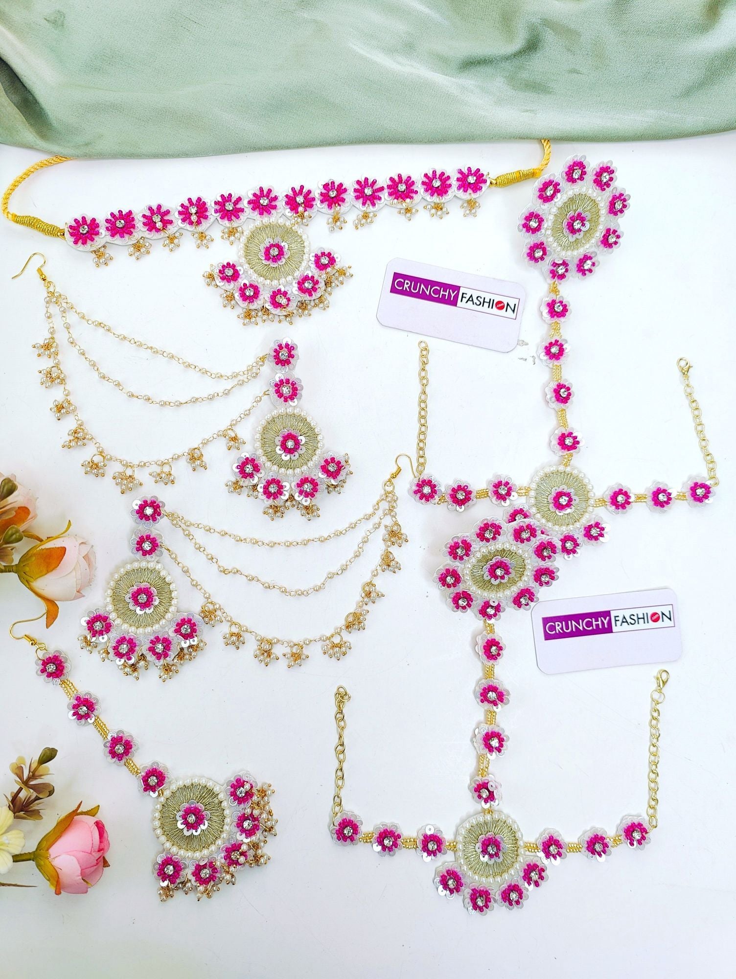 Handmade pink floral jewellery set with asymmetric design for brides, ideal for haldi-mehndi and carnival occasions