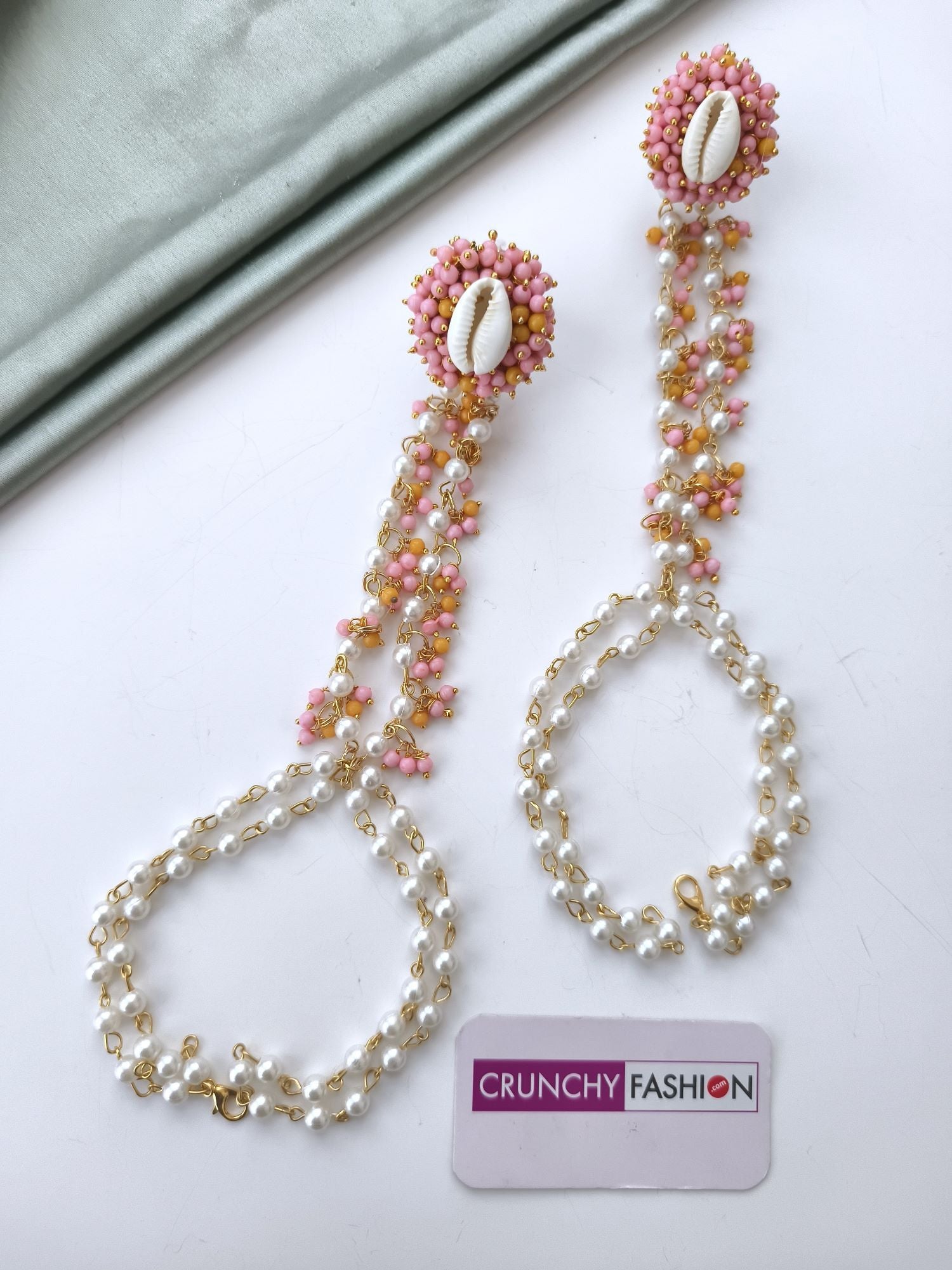 Yellow and pink haldi mehndi jewellery set with gold-plated seashells, pearls, floral design for women and girls