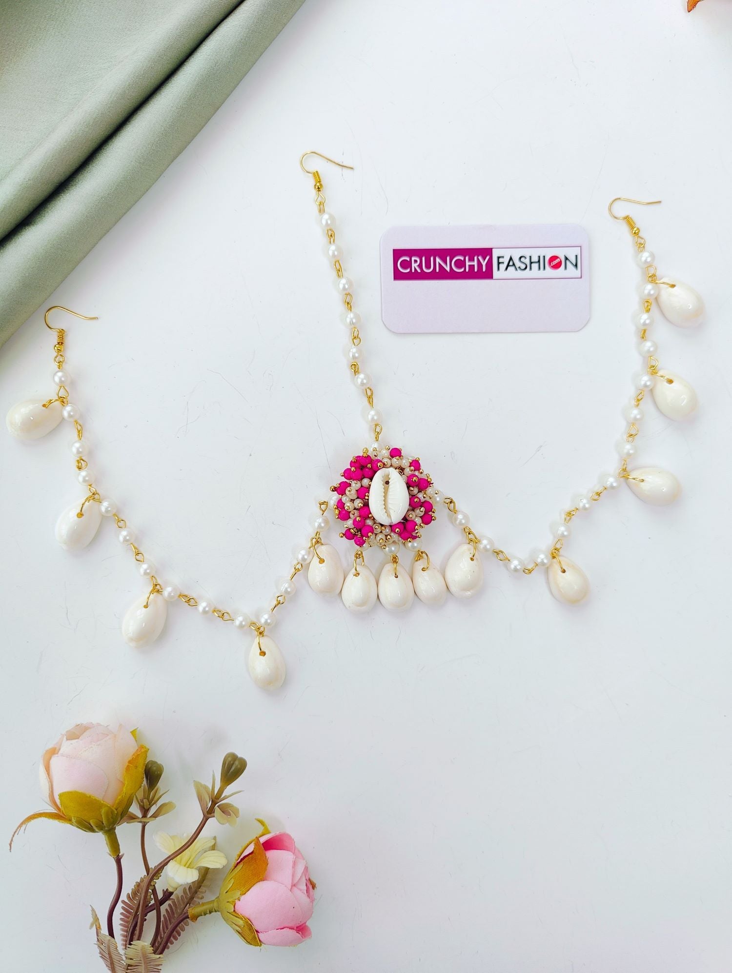 Bridal pink haldi jewellery set with sea shells, pink-white pearls; trending shell floral set for haldi-mehndi 2026