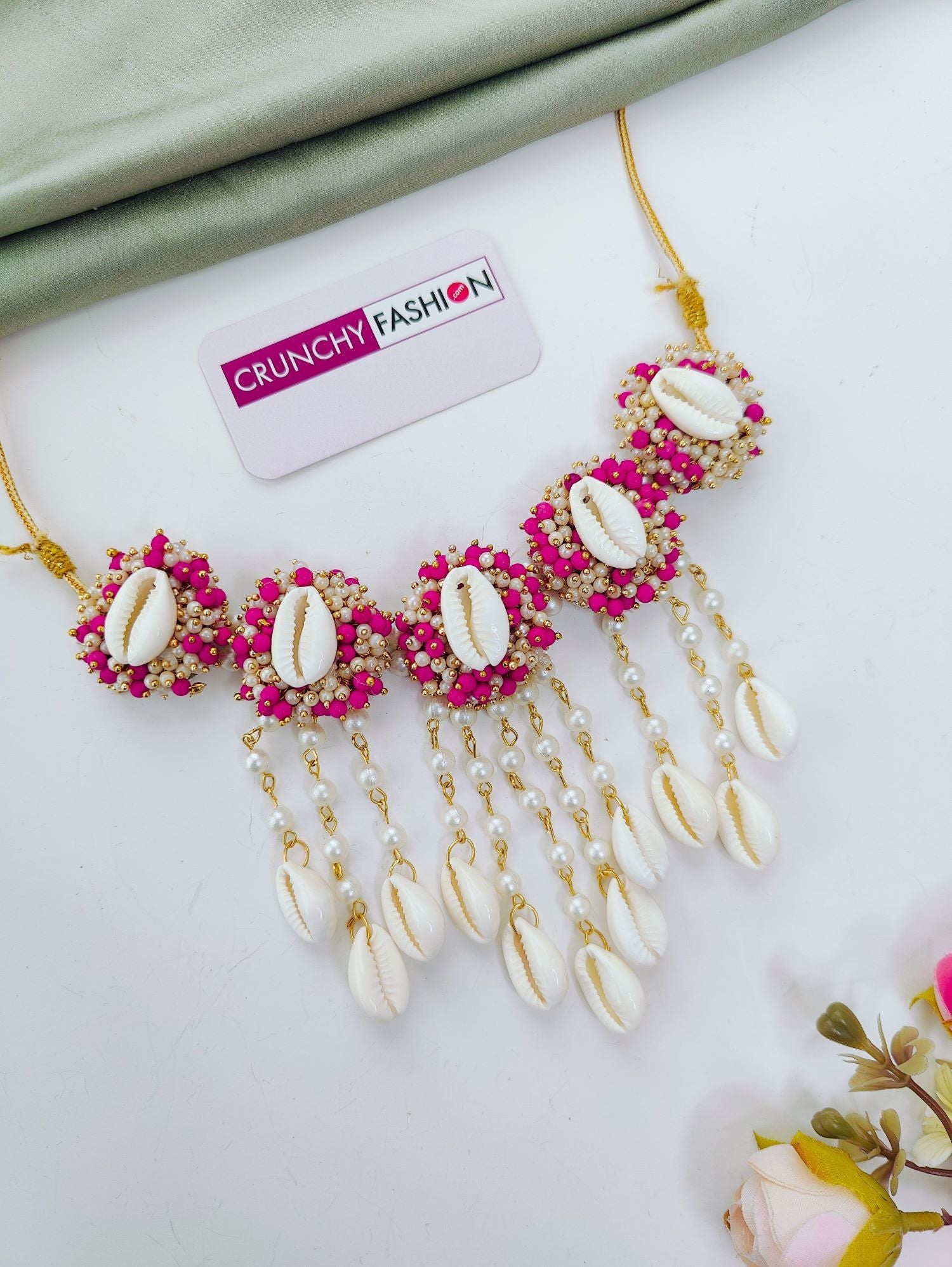 Bridal pink haldi jewellery set with sea shells, pink-white pearls; trending shell floral set for haldi-mehndi 2026