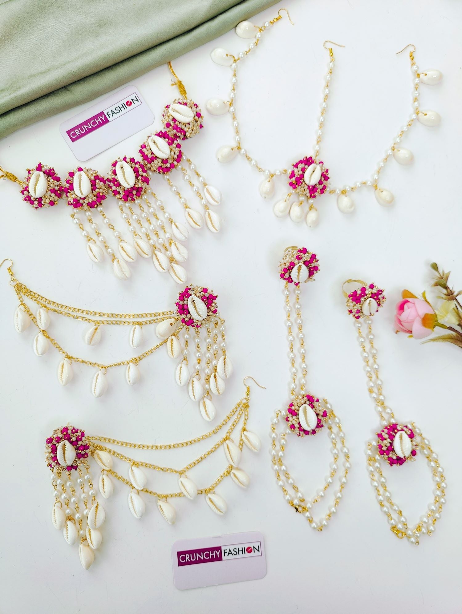 Bridal pink haldi jewellery set with sea shells, pink-white pearls; trending shell floral set for haldi-mehndi 2026