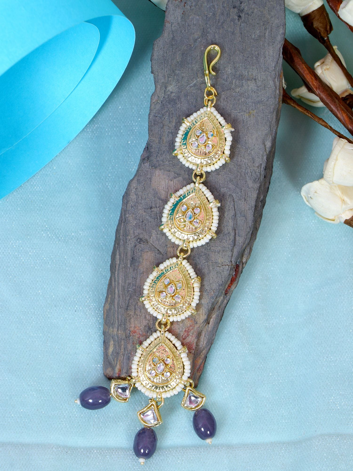 Elegant kundan maang tikka jewellery in gold and blue alloy, ideal for women and girls on wedding, festival or engagement occasions