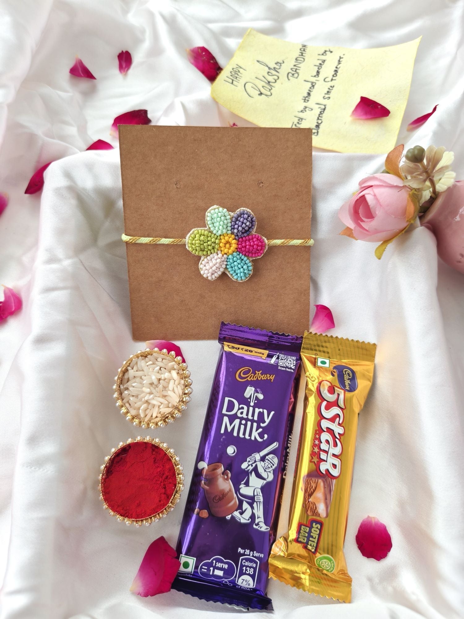 cute flower rakhi hamper for brother with KitKat chocolate, roli chawal
