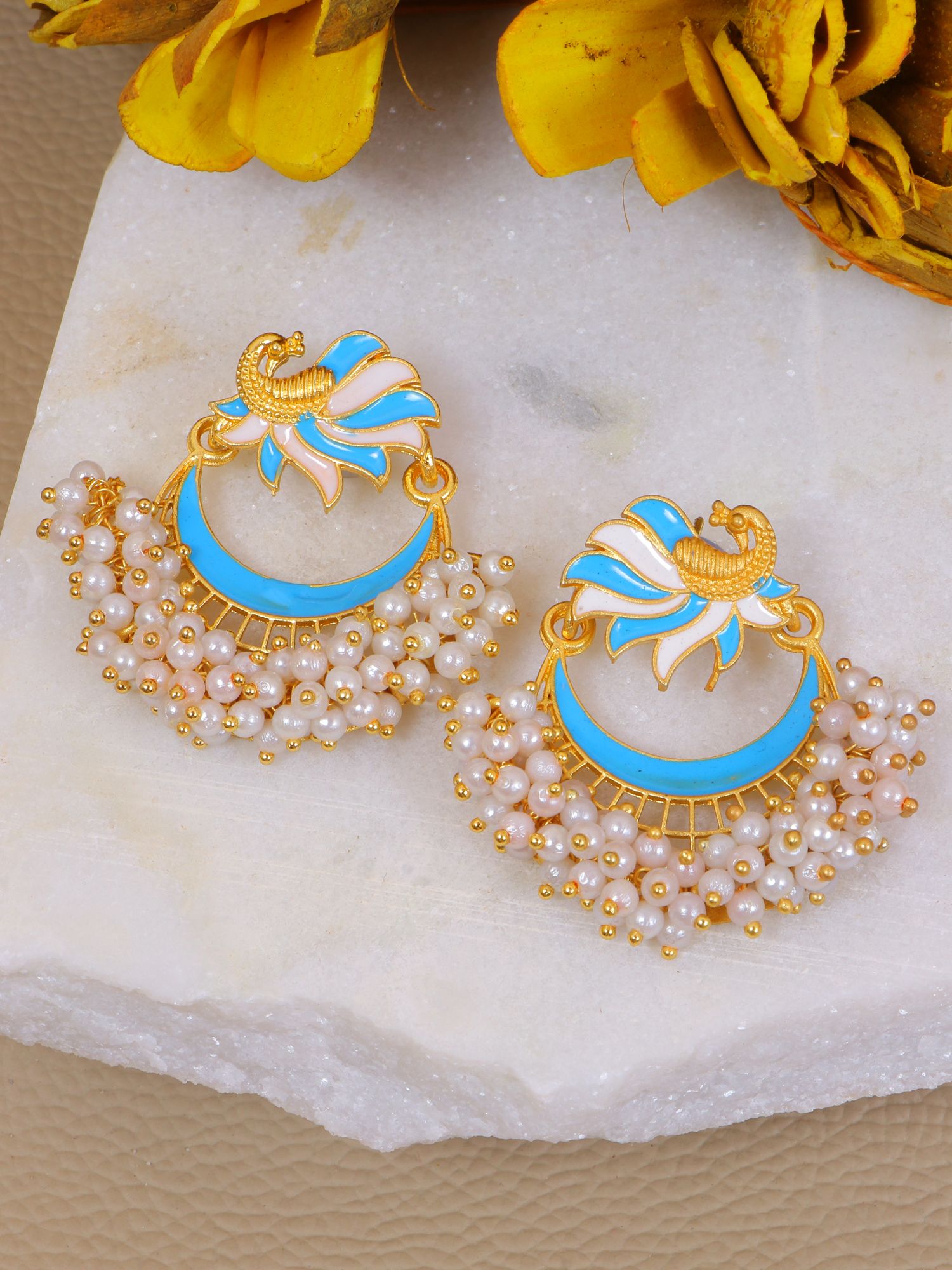 Gold-plated, half moon shaped, peacock design Meenakari earrings in white and blue for girls