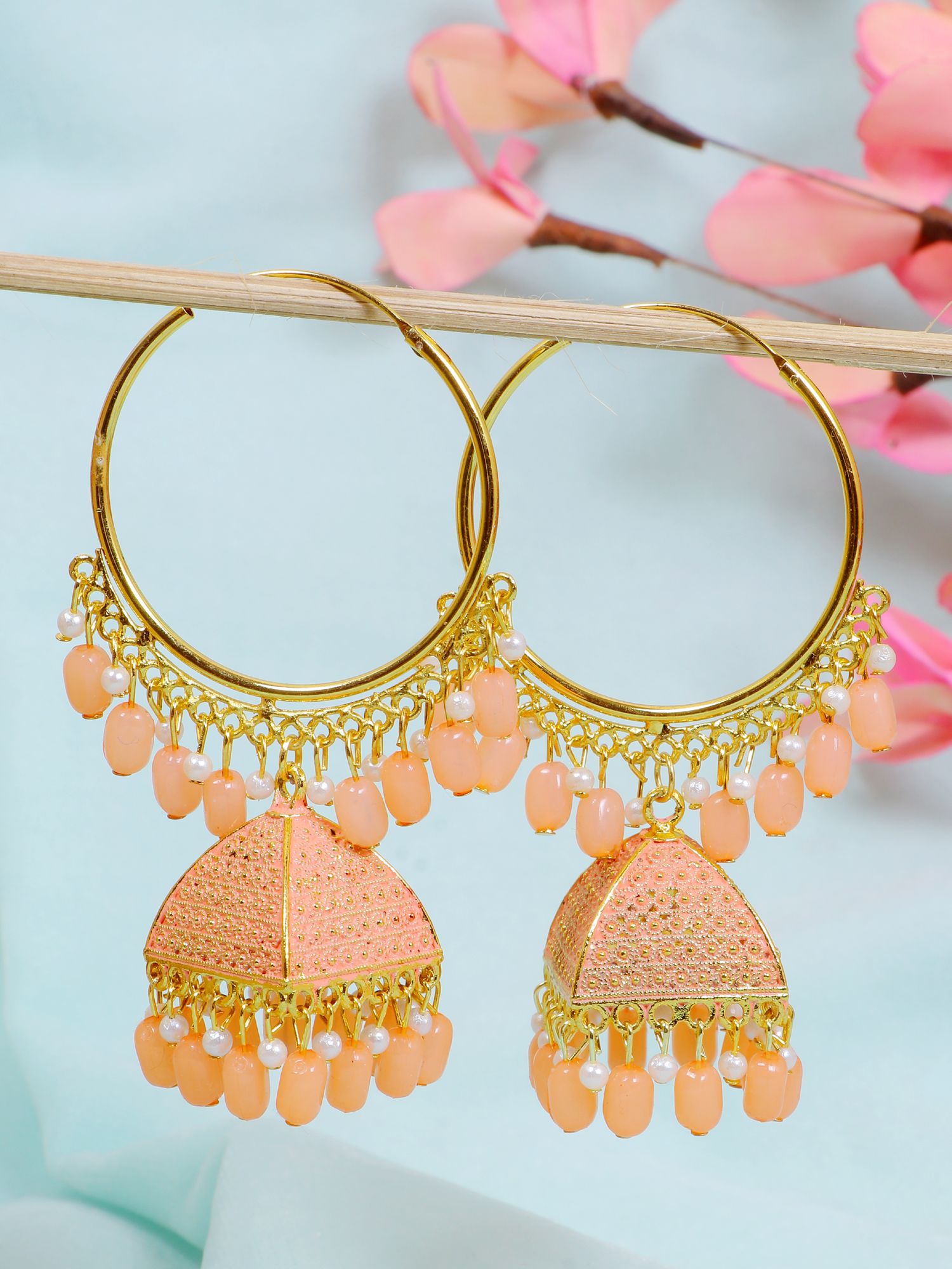 Ethnic peach-colored Meenakari jhumka earrings design in traditional style for women, made from alloy and gold-plated