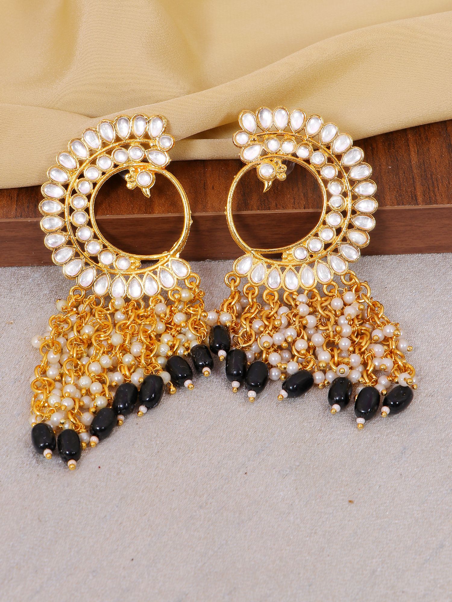 Gold-plated Peacock-themed asymmetric pearl dangler earrings for women, suitable for ethnic occasions