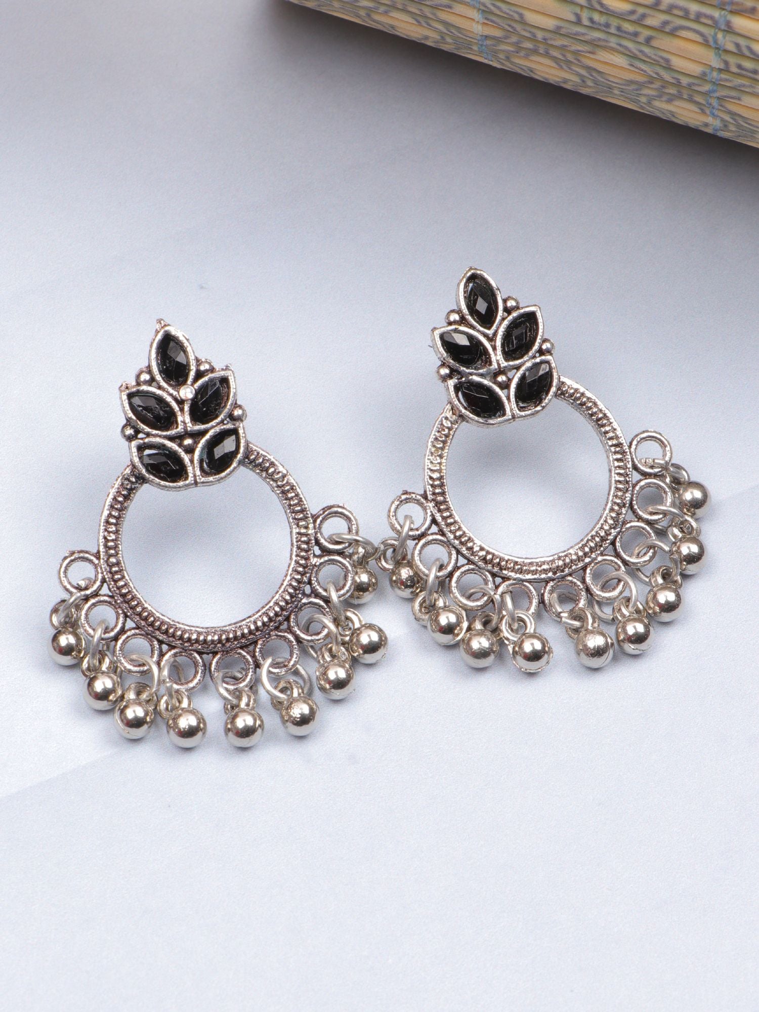 Contemporary oxidized earrings with black stones, asymmetric design and silver plating, ideal for women on various occasions
