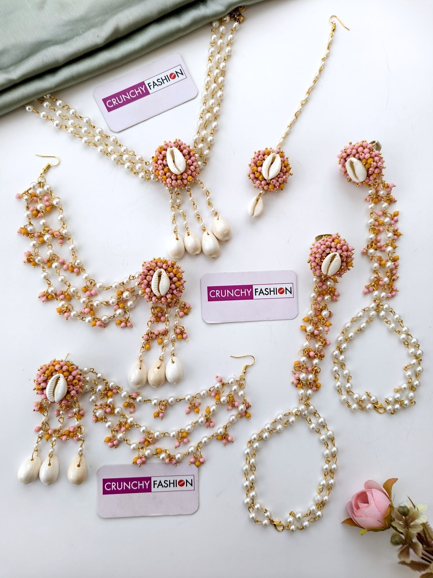 Yellow and pink haldi mehndi jewellery set with gold-plated seashells, pearls, floral design for women and girls
