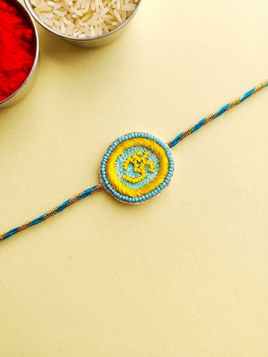 Handmade Sky-Blue OM Rakhi Set for Brother & Bhabhi – Latest Rakhi 2026