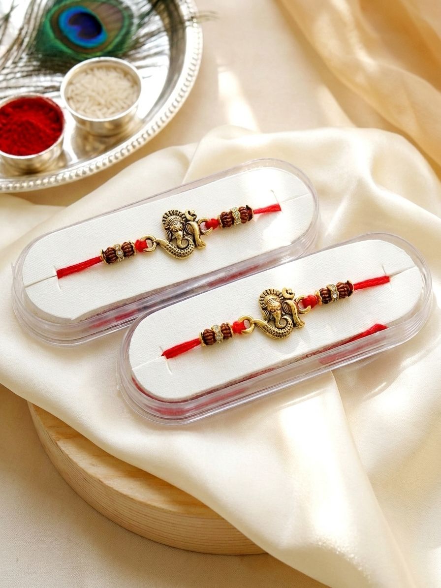 Chic Ganpati Duo Rakhi: Oxidized Gold Spiritual Jewelry