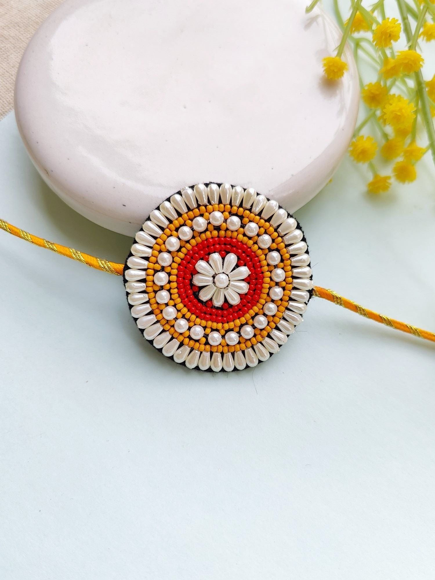 Handcrafted Pearl Beaded Rakhi Set for Brother & Bhabhi