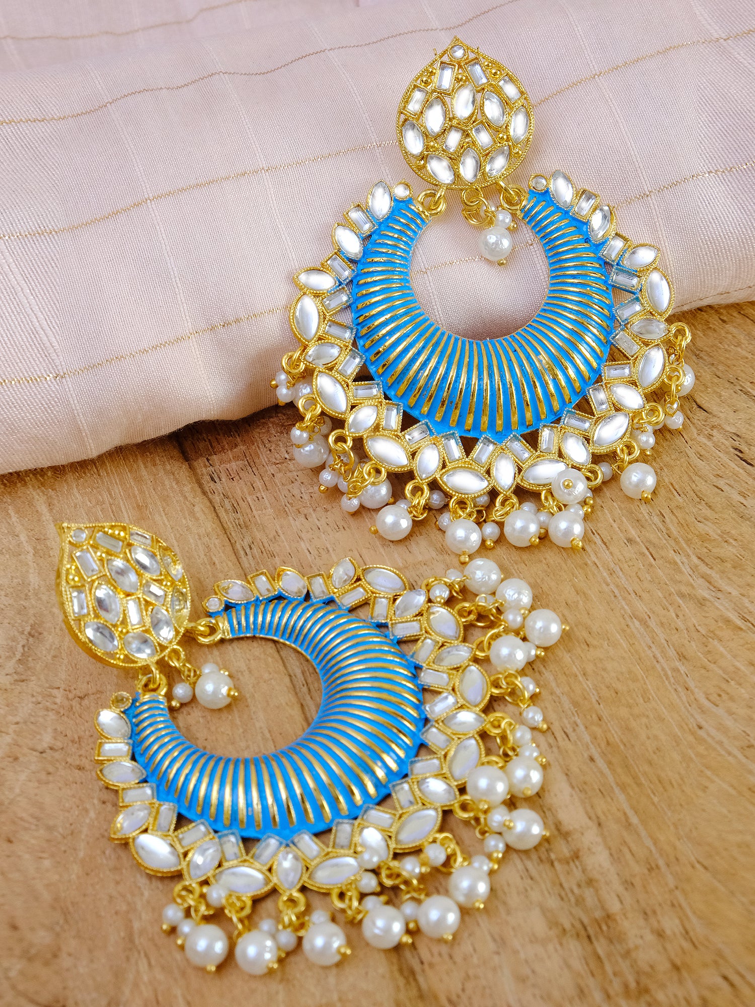 Women's Gold-Plated Kundan-Studded Long Danglers Earrings with Pearls: A Perfect Match for Sky Blue Sarees